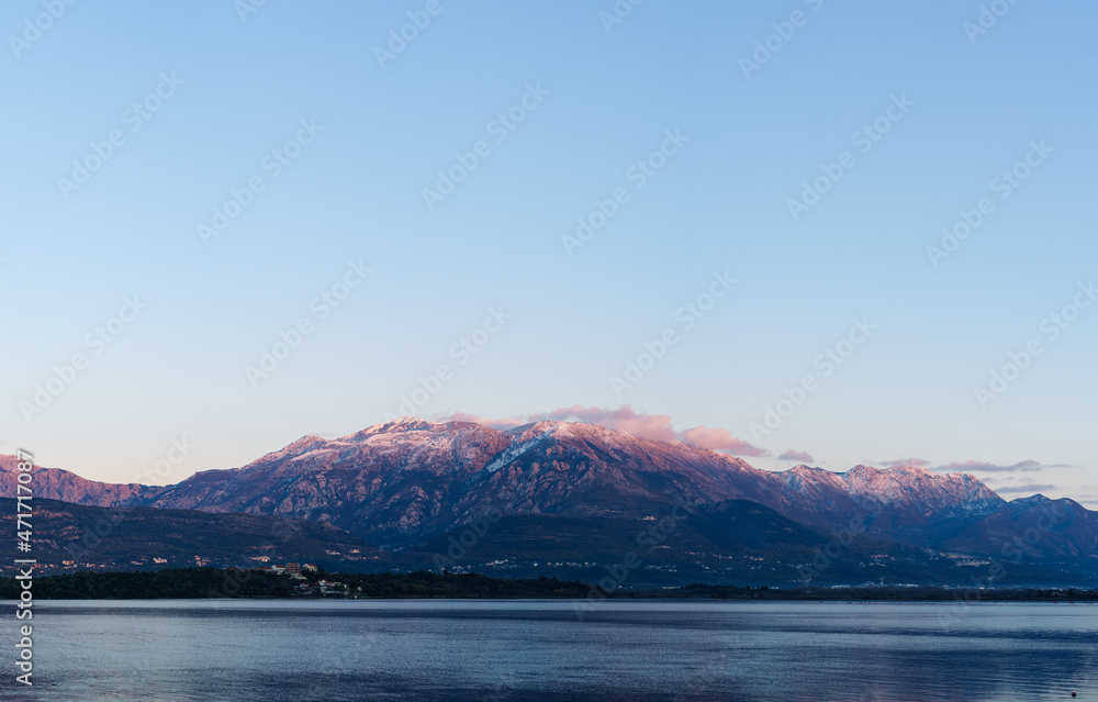 Sunset over Mount Lovcen. View from the sea