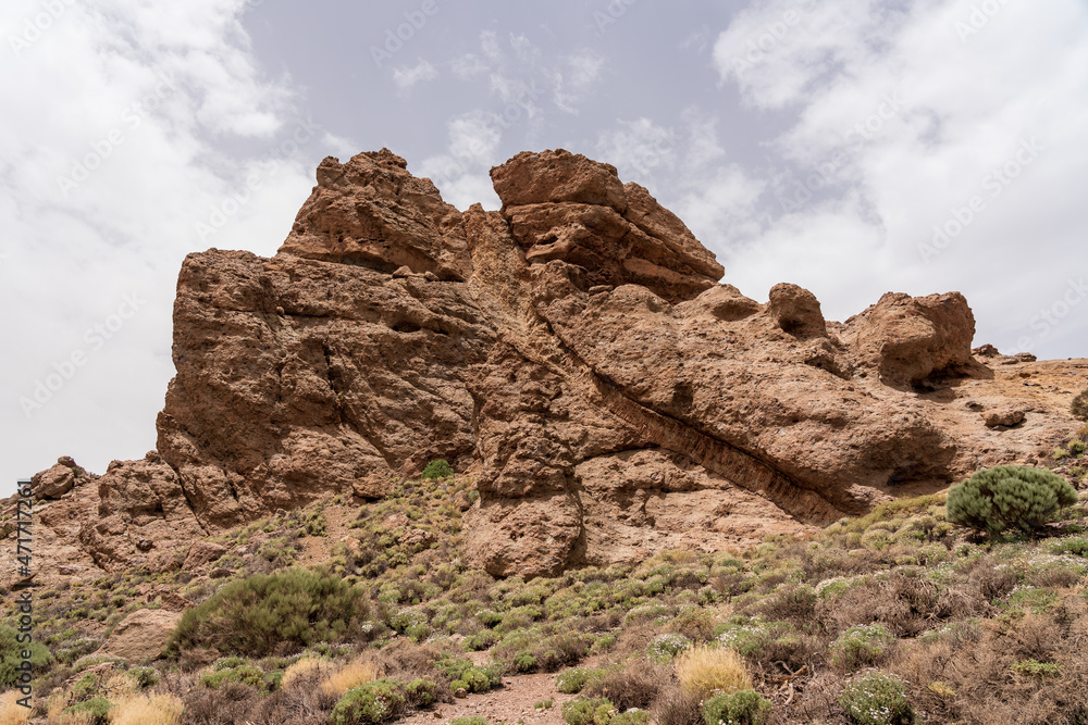 Fototapeta premium The lava fields of Las Canadas caldera of Teide volcano and rock formations - Roques de Garcia. Tenerife. Canary Islands. Spain.