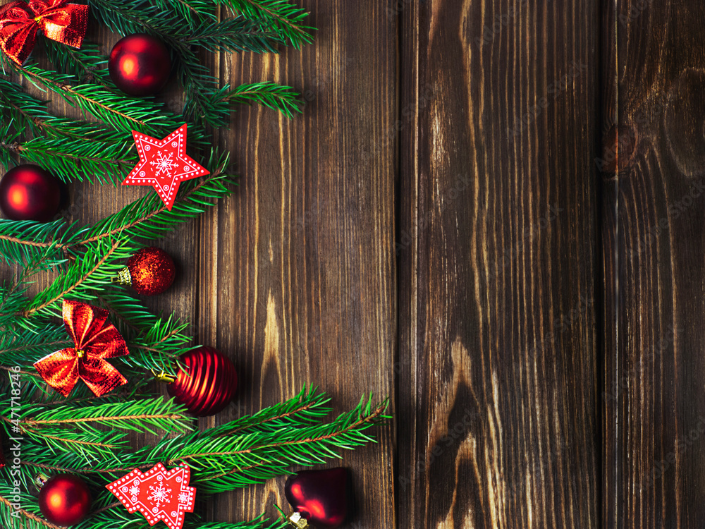 Christmas tree toys on a wooden background with fir branches. Festive background, Christmas. Christmas tree toys on a wooden background with fir branches. Festive background, Christmas.