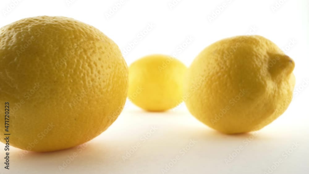 Extreme close-up, detailed . yellow ripe lemons isolated on white background