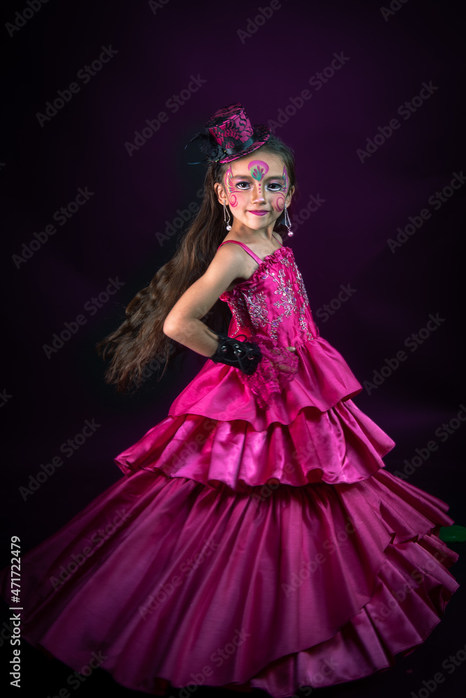 smiling long hair latin girl dressed in pink celebrating christmas with sparkling accessories hats gloves and colored lights smiling long hair latin girl dressed in pink celebrating christmas with sparkling accessories hats gloves and colored lights
