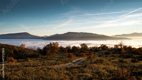 Fototapeta Naklejka Na Ścianę i Meble -  hilly mountain landscape with fog at dawn
