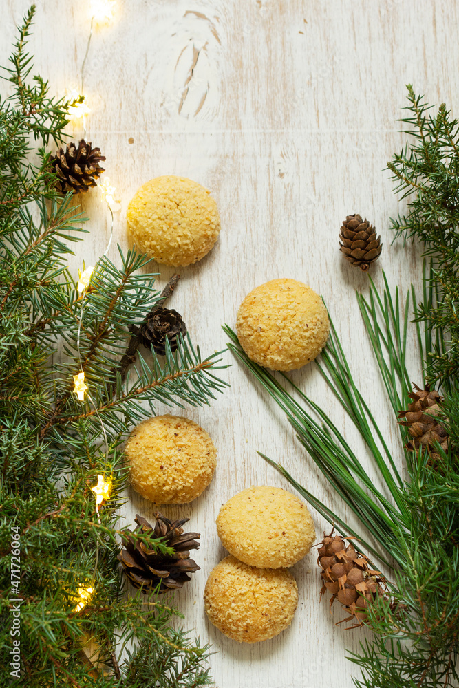 Christmas nut cookies Filbertines on a background of branches, cones and Christmas decorations. Christmas nut cookies Filbertines on a background of branches, cones and Christmas decorations.