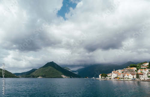 Perast coast against the background of mountains. Montenegro photo