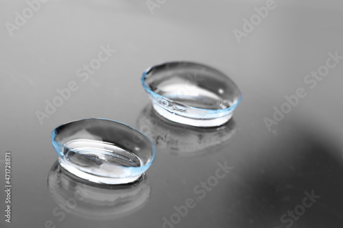 contact lenses on dark background close up view - Image
