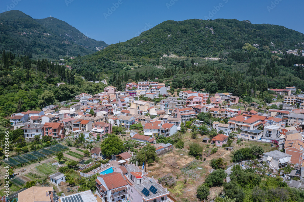 Aerial drone photo of Benitses town on the Ionian Sea shore on Corfu Island, Greece