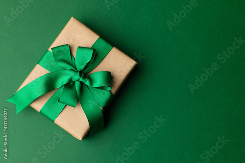 Box wrapped in craft paper on craft paper background