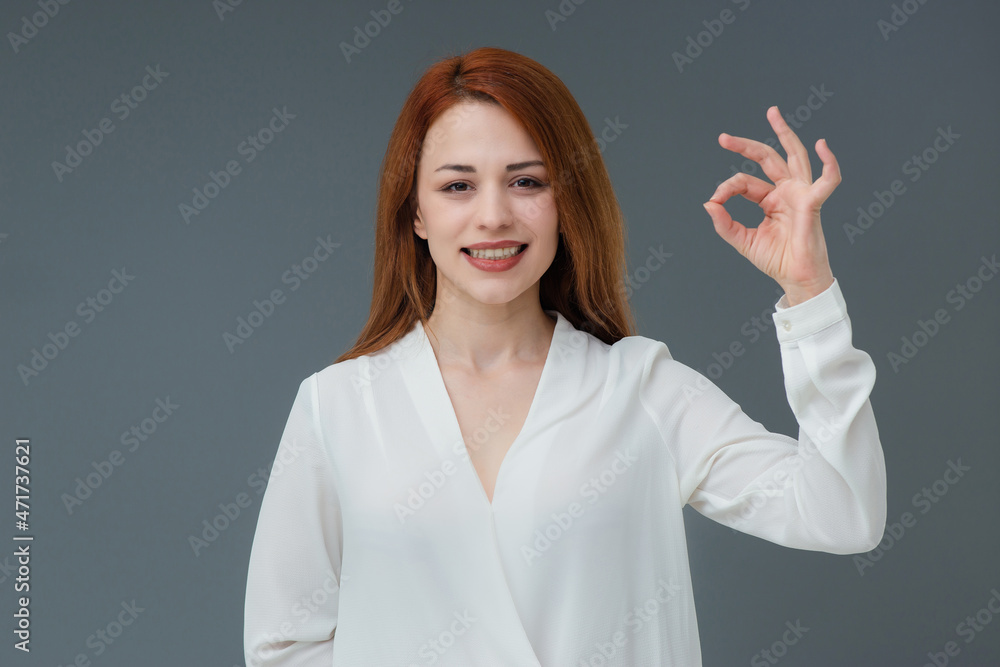 Beautiful smiling Turkish young woman, gestures thumbs up, Includes copy space. Beautiful smiling Turkish young woman, gestures thumbs up, Includes copy space.