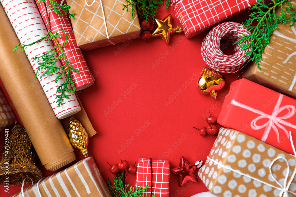 new year gifts and decorations on red background top view/