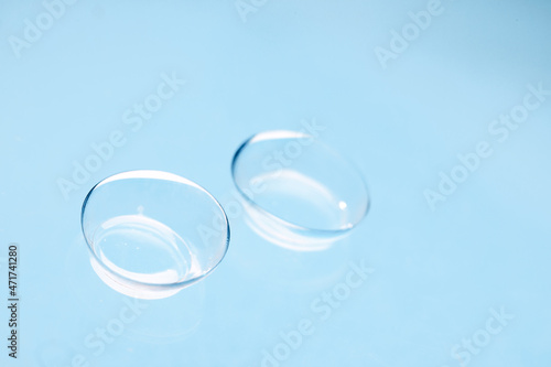 contact lenses on blue backgroundn close up view  - Image photo