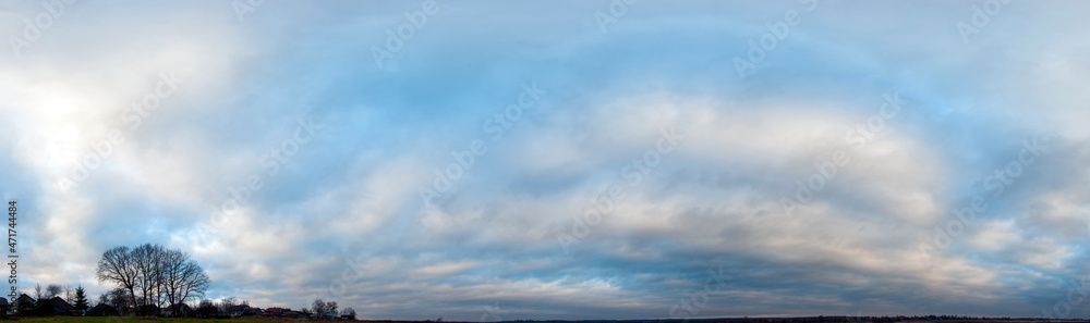 Fototapeta premium Panorama of sunny and stormy sky on a background of mountains