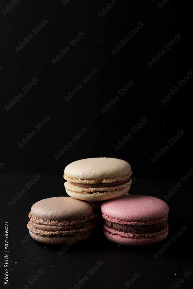 Three macarons with black background below Three macarons with black background below