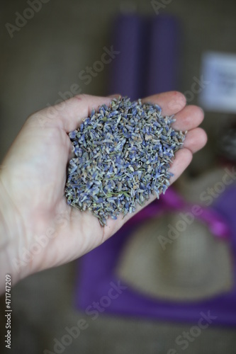 Violet dry lavender heap on rustic background.
