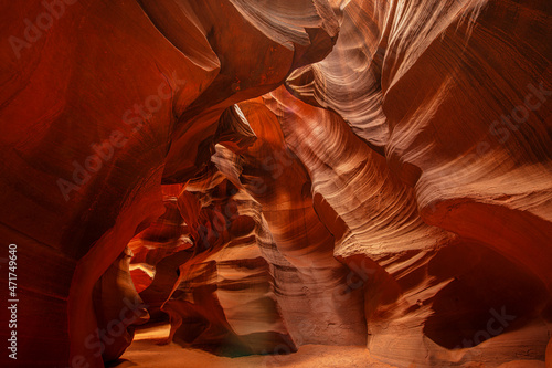 Famous Antelope Canyon near Page in Arizona. Beautiful colored and luminous sandstone walls shine through the warming rays of the sun shining through the rocks canyons.