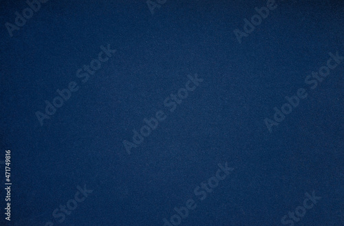 A blank blue sheet of paper. Space for text on a blue background. Dark blue shade of craft paper. The background is blue.