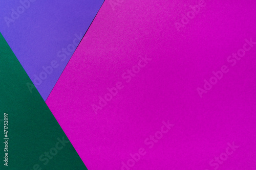 Bright multicolored background of violet and green colors. Minimal composition. Color trends 2022. Top view