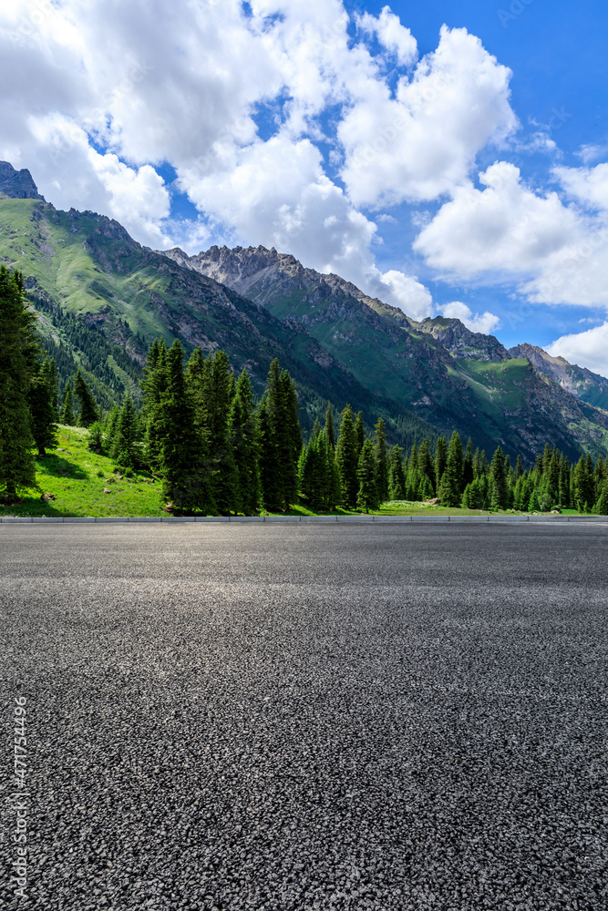 Asphalt road and mountain under blue sky. Highway and mountain background.