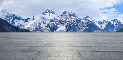 Empty square floor and snow mountain background