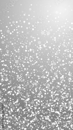 Magic stars Christmas background. Subtle flying snow flakes and stars on grey background. Appealing winter silver snowflake overlay template. Classy vertical illustration.