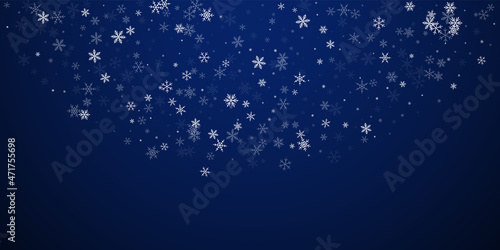 Sparse snowfall Christmas background. Subtle flying snow flakes and stars on dark blue night background. Beautiful winter silver snowflake overlay template. Mind-blowing vector illustration.
