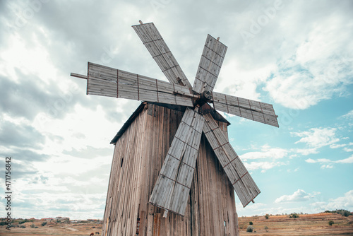 Old wooden windmill in the field 