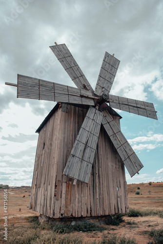 Old wooden windmill in the field 