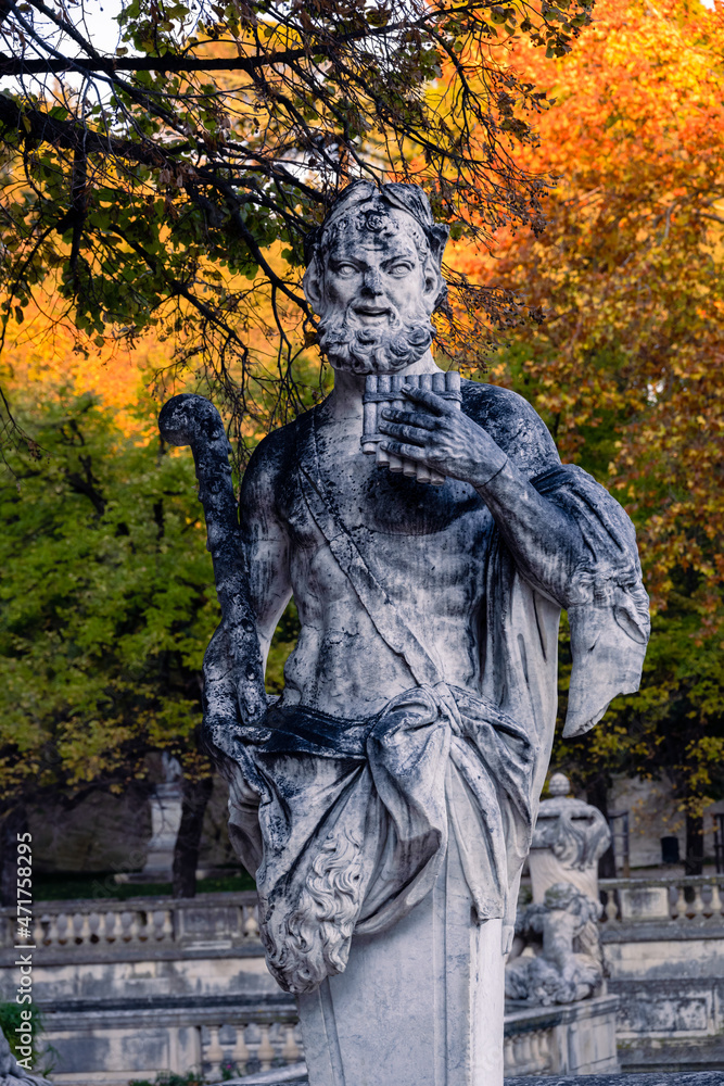 Statue of Pan, Gardens of the Fountain (Jardins de la fontaine) in autumn, Nîmes, France Statue of Pan, Gardens of the Fountain (Jardins de la fontaine) in autumn, Nîmes, France
