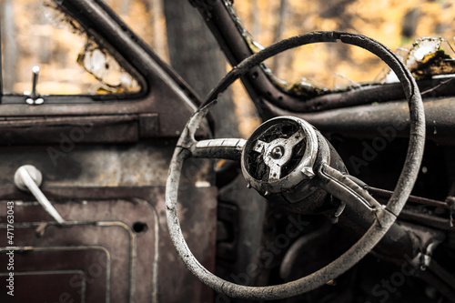 Antique car left abandoned to time in the New York woods.  © Mark Lotterhand