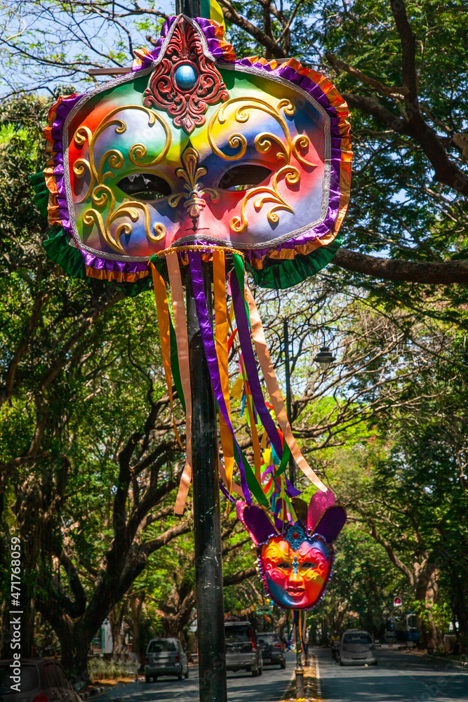 Vibrant colored and unique shaped masks displayed along the city streets in Panaji city during Goa Carnaval in Goa, India.  - obrazy, fototapety, plakaty 