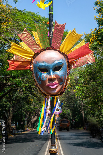 Vibrant colored and unique shaped masks displayed along the city streets in Panaji city during Goa Carnaval in Goa, India. 