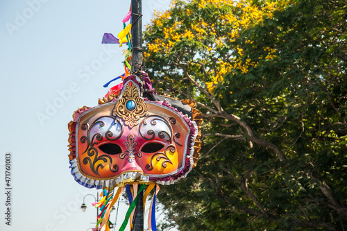 Vibrant colored and unique shaped masks displayed along the city streets in Panaji city during Goa Carnaval in Goa, India. 