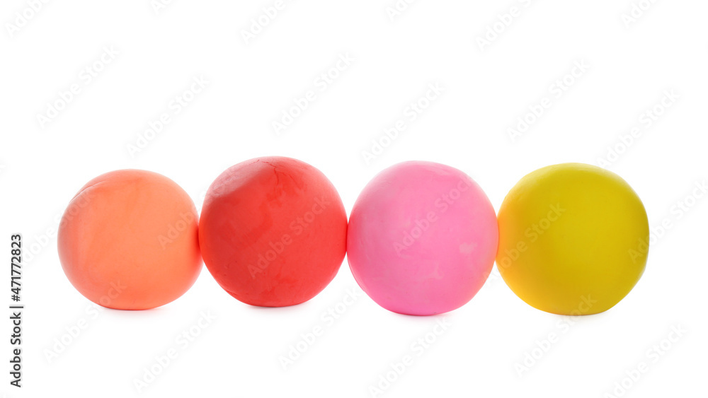 Row of color play dough balls isolated on white