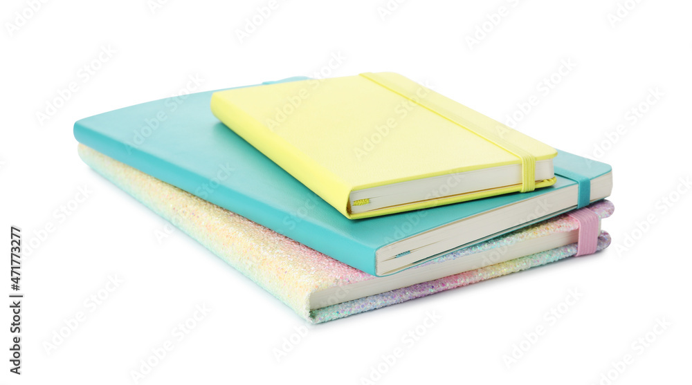 Stack of different colorful hardcover planners on white background Stack of different colorful hardcover planners on white background