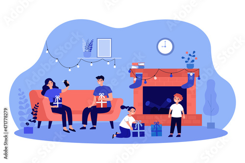 Family unpacking Christmas gifts by fireside. Parents and children holding their presents flat vector illustration. Winter holidays celebrating concept for banner, website design or landing web page
