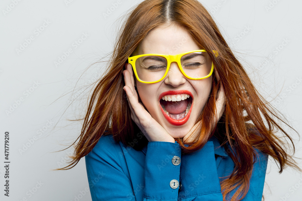 cheerful national woman wearing yellow glasses blue shirt close-up cheerful national woman wearing yellow glasses blue shirt close-up