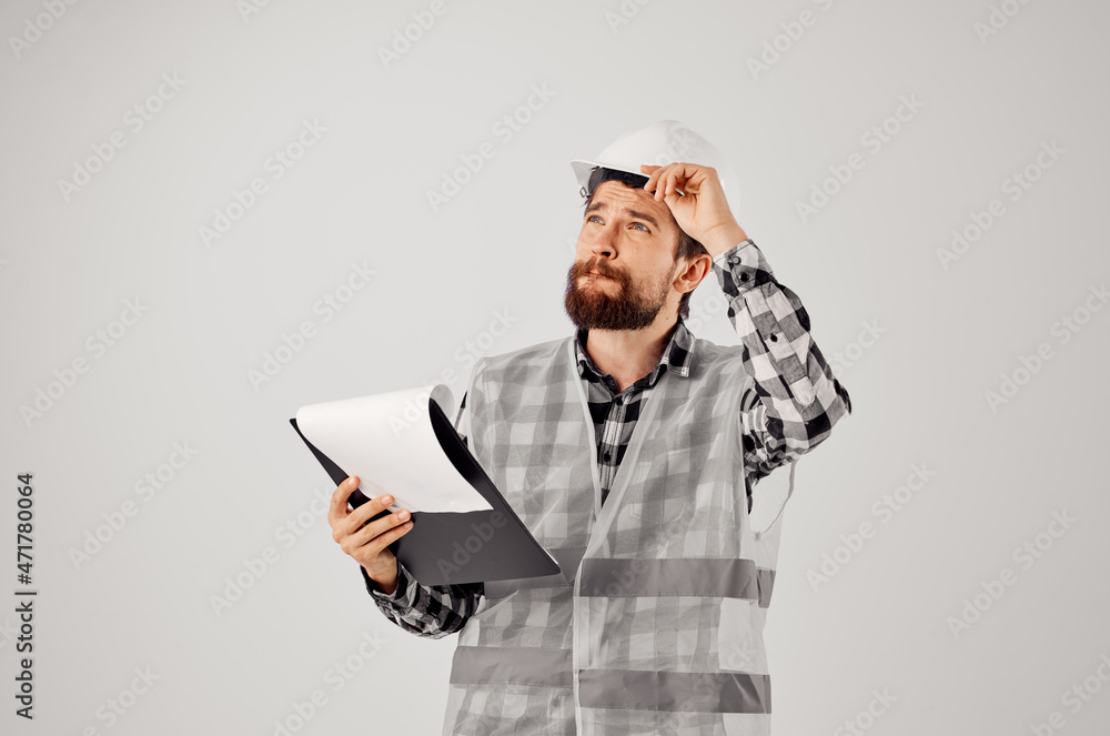 engineer in a white helmet blueprints Professional isolated background