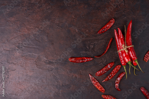Fresh chili, dried chili, placed on a dark background. top view with copy space