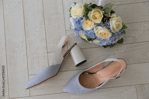 bridal shoes and bouquet