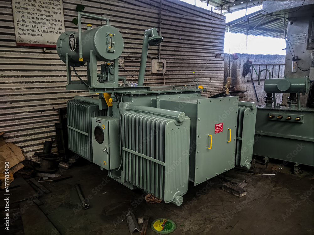 3-phase distribution Transformer tank with all the parts connected. 3-phase distribution Transformer tank with all the parts connected.