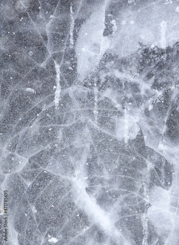 Crushed ice in a puddle as an abstract background.
