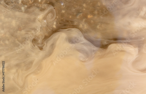 Muddy brown water in a puddle