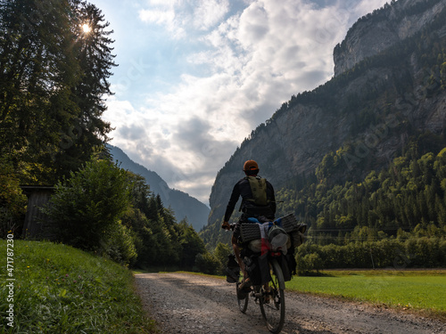 person riding a bike in the mountains