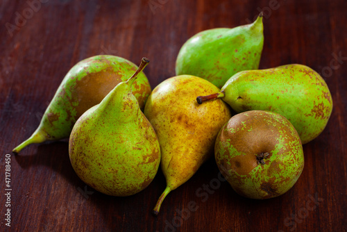 Ripe green pears on wooden background. Healthy vitamin product..