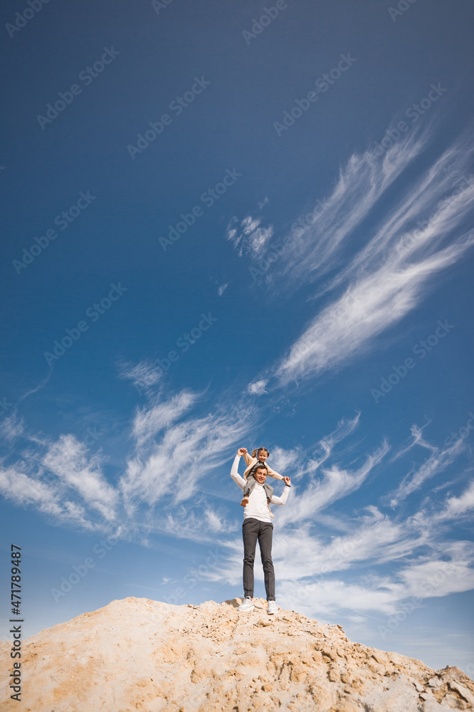 Dad and daughter on the background of clouds 3315. Dad and daughter on the background of clouds 3315.