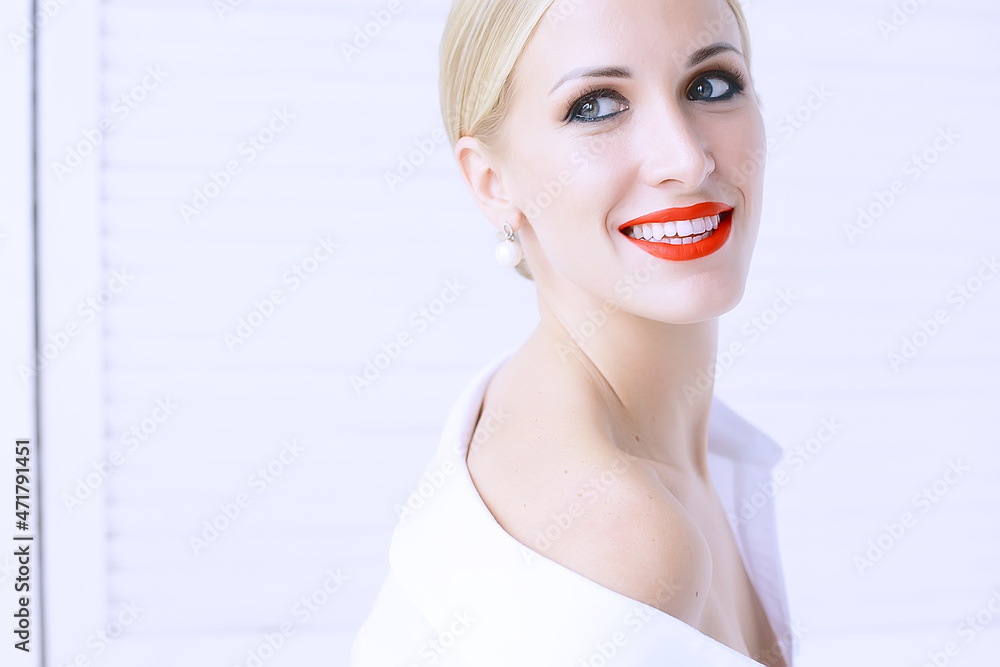 model with professional make-up and bright red lips / beautiful make-up on the face of the model, saturated with bright red lipstick on the lips model with professional make-up and bright red lips / beautiful make-up on the face of the model, saturated with bright red lipstick on the lips