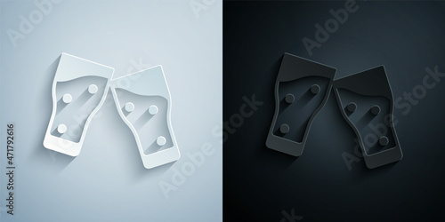 Paper cut Glass of beer icon isolated on grey and black background. Paper art style. Vector