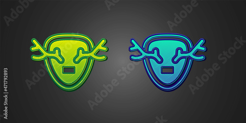Green and blue Deer antlers on shield icon isolated on black background. Hunting trophy on wall. Vector