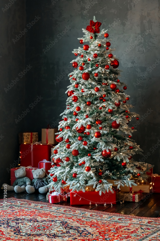 Christmas tree and gift boxes near the window. High quality photo