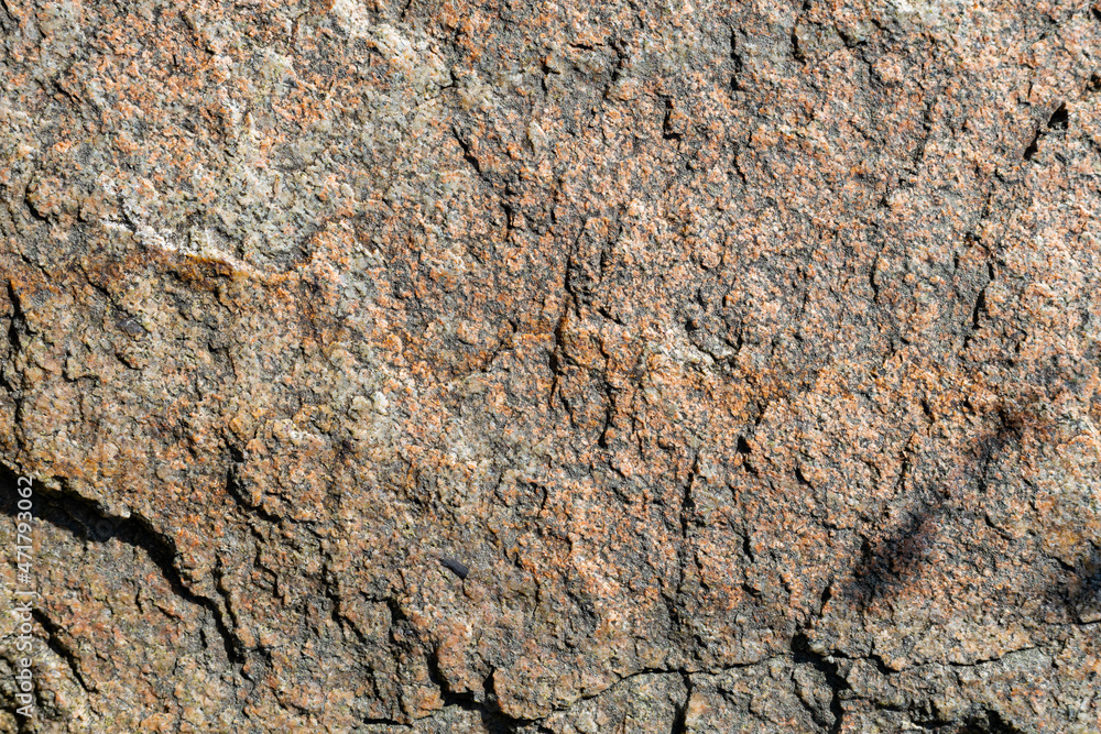 Cracked granite stone texture. Granite rock surface. Natural stone backdrop Cracked granite stone texture. Granite rock surface. Natural stone backdrop