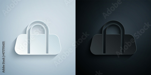 Paper cut Sport bag icon isolated on grey and black background. Paper art style. Vector